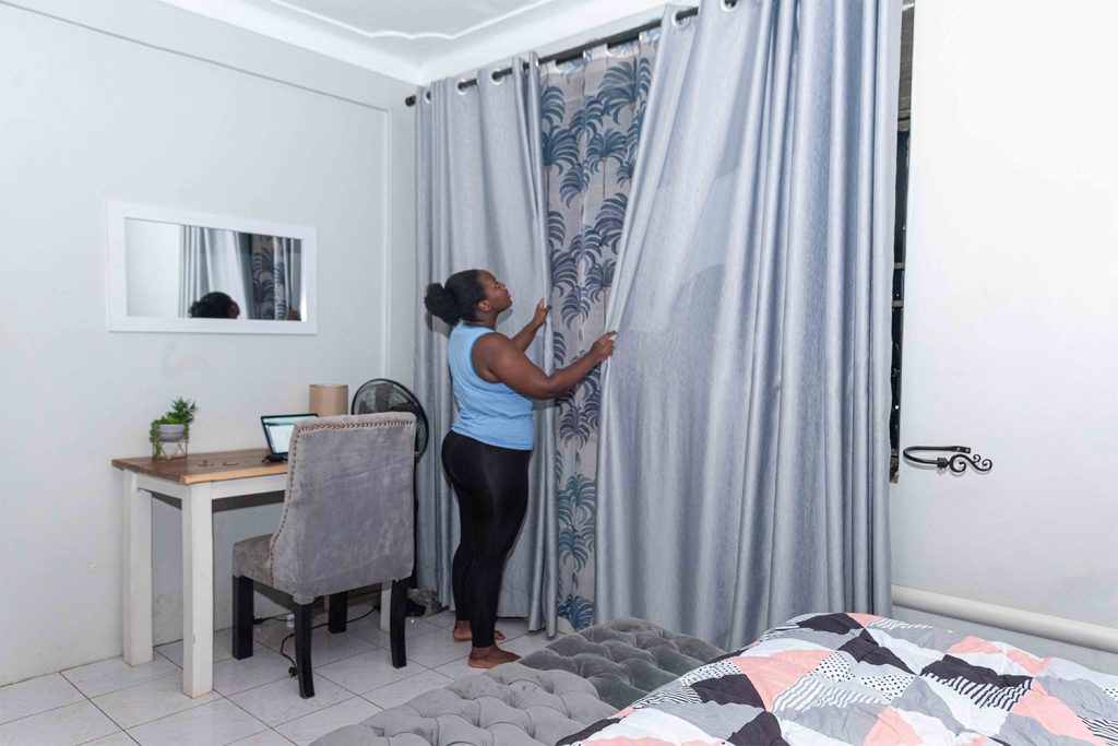 lady drawing curtains